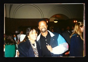 Unidentified man & woman in a crowd