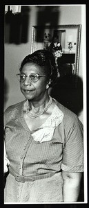 Unidentified woman near mirror