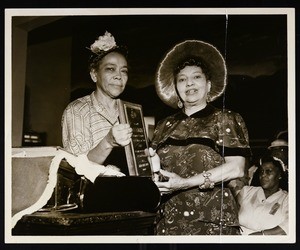 Unidentified woman receiving an award, COGIC national convention, Miami