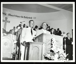 2 men at the pulpit at an unidentified COGIC gathering, Chicago