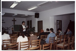 Franc Kuzmič reading to people