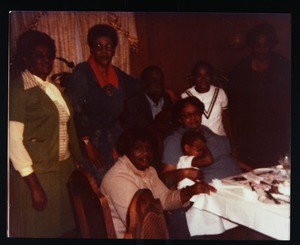 Group of people at a social gathering including Simmons, Clemmons, Martin & Walton