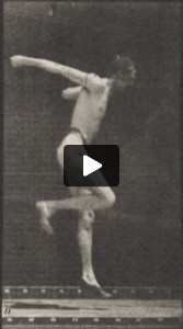 Man in pelvis cloth jumping horizontal bar
