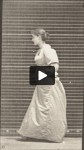 Woman walking and turning around with a bouquet in both hands