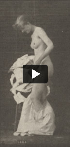 Nude woman sitting and disrobing