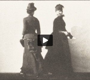 Two women walking, meeting and partly turning