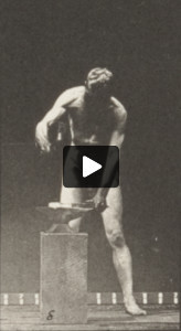 Nude man hammering at an anvil