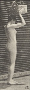Nude woman stooping and lifting a 12-lb. basket to head