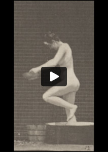 Nude woman pouring water over head