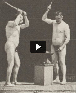 Two nude blacksmiths hammering on anvil