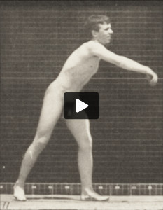 Nude man throwing baseball