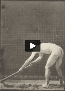 Nude farmer using a pick