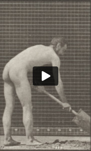 Nude farmer using a spade