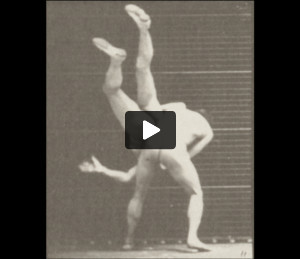 Two men in thong underwear boxing cross-buttocks