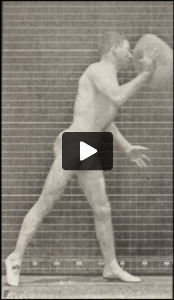 Man in pelvis cloth throwing rock