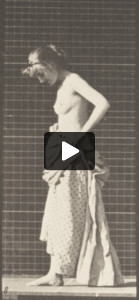 Nude woman inside toilet, putting on a dress and turning around