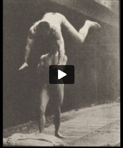 Nude man springing over a man's back