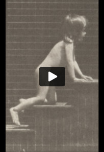 Nude child crawling on stairs