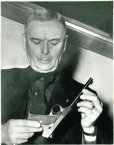 Frank Higgins Examinging Gun