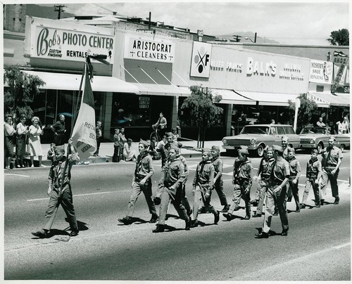 Scout Day Parade: Scouts Marching West on Mission with Rotary Flag