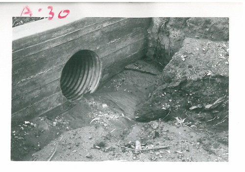 Drainpipe Surrounded by Debris