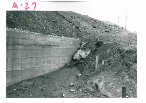 Muddy Area of Retaining Wall After Flooding