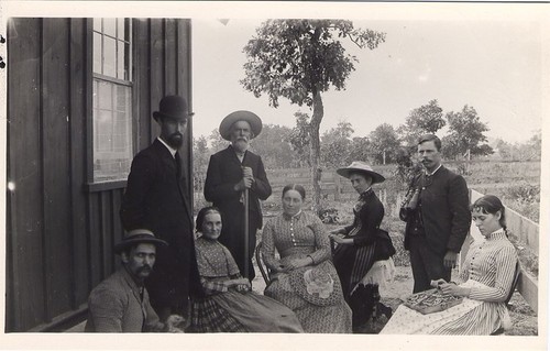 Unidentified Men and Women in Back Yard