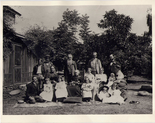 H.N Rust and Group (People Identified) Posing in Back Yard of Rust Home