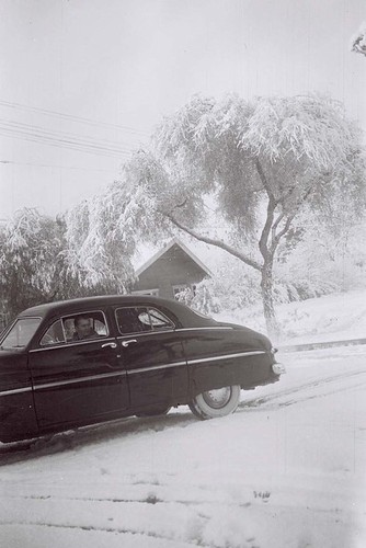 Snow-Covered Car in Parking Lot at S. Paul Ward Inc