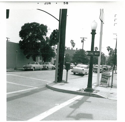 Intersection, Sign on Corner Reads "We gGve Halmark Trading Stamps"