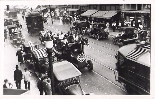 Flag-Draped Autos on Busy Street, Looking West on Colorado