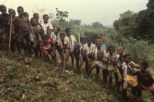 Boys playing outside of village after school