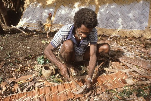 Kainding Biank making roof thatch 2 of 2