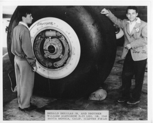 --donald douglas jr. donald douglas jr. with his brother william alongside b-19 landing gear santa monica california 1941