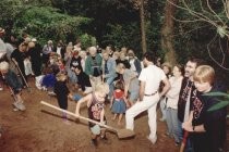 Adults and children digging at groundbreaking for library addition, 1997