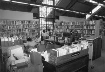 Reference desk and shelving area, 1985