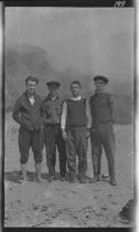 Four men standing at Willow Camp, 1919