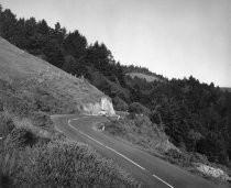 Car on mountain road, date unknown
