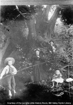 Family playing and fishing in creek, date unknown