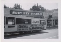 Promotional trailer parked on Throckmorton Avenue, circa 1954