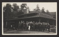 Group in front of Muir Woods Inn, with dog on hind legs, early 1900s