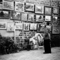 A man viewing the Marin Society of Artists Show at El Paseo courtyard, 1941