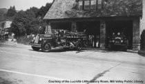 Fire truck coming out of station, 1940s