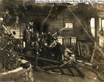 Firefighters after a blaze, date unknown