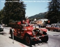 Fireman on vintage fire truck at History Walk, 1982