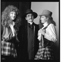 Portrait of Don Novello and two women, circa 1990s