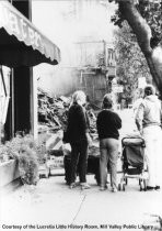 People viewing the ruins building destroyed in fire 1984