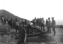 Crew tearing up railroad track, 1930