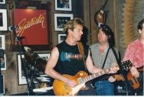 Dennis Quaid with guitar