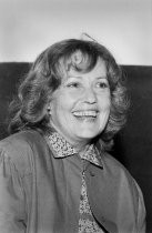 Jeanne Moreau, smiling, 1982
